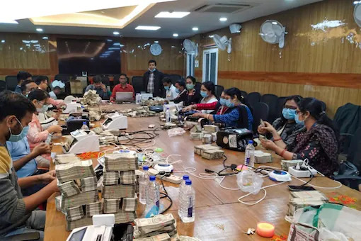 Cash counting by officials of the Income Tax department raids in Ranchi. (PTI Photo)
